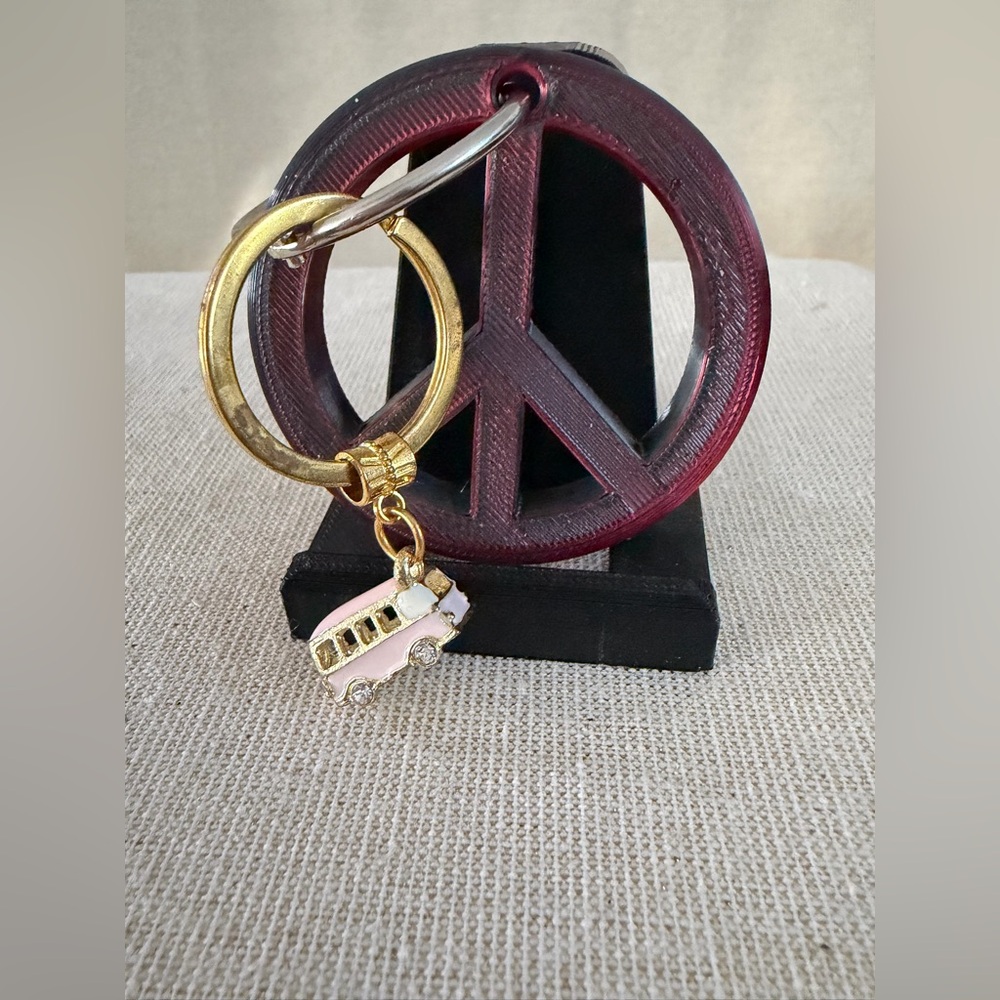 Gold Ring Keychain with Pink Bus Charm also peace sign keychain